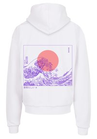 Sweatshirt blanc avec un graphique violet représentant des vagues et un grand cercle rose, encadré par un contour rectangulaire et des caractères japonais.