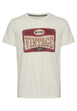 Tricou din bumbac de culoare crem, cu un grafic de stil vintage în nuanțe de roșu, bej și negru. Dispune de guler rotund și mâneci scurte.