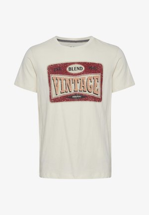 Tricou din bumbac de culoare crem, cu un grafic de stil vintage în nuanțe de roșu, bej și negru. Dispune de guler rotund și mâneci scurte.