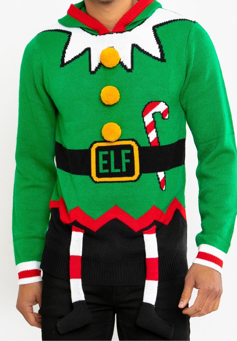Pull en tricot vert avec des accents rouges, présentant un design d'elfe, des boutons en pompon, des détails en canne de bonbon et des chaussettes suspendues à la taille.