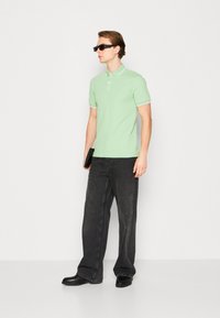 BOSS PASSERTIP - Polo shirt - open green