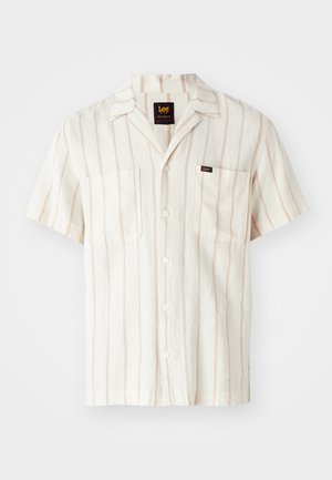 Short-sleeve shirt in cream with subtle pink stripes. Features a collar, two front pockets, and a logo label on the left pocket.