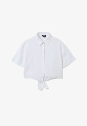 Camicia corta bianca a maniche corte con colletto, chiusura con bottoni davanti e dettaglio con fiocco sul davanti. Realizzata in tessuto leggero e liscio.