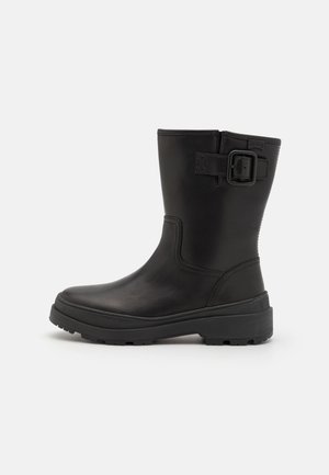BRUTUS TREK - Platform ankle boots - black