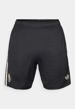 Mustad mustad sportlikud lühikesed püksid kerge kangaga, millel on alumises vasakus nurgas kuldne logo ja külgedel kaks vertikaalset valget triipu.