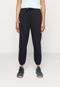 Under Armour - ESSENTIAL JOGGERS - Tracksuit bottoms - black/white Thumbnail Image 1