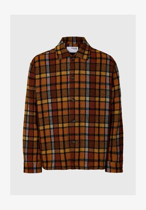 Pruunruuduline särk oranži, kollase ja sinise aktsendiga, kraega kaeluse ja nööpidega esiotsa, valmistatud tekstuurse kangaga.