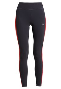 Leggings neri realizzati in tessuto elastico con pannelli laterali rossi, vita alta e un logo sottile sulla parte anteriore della gamba inferiore.
