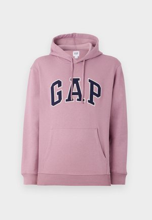 Sudadera rosa con capucha. Presenta un gran logo en marino de "G.A.P.", bolsillo tipo canguro y puños y dobladillo acanalados. Material suave.
