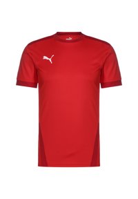 Czerwona sportowa koszulka Puma z krótkimi rękawami, okrągłym dekoltem i białym logo na lewej piersi; gładka faktura, lekki materiał.