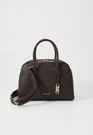 Dark brown leather handbag with twin handles, detachable strap, and gold-tone hardware. Features a gold logo and a textured surface.