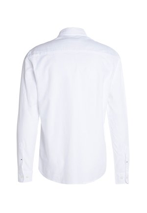 Vue de dos d'une chemise blanche à manches longues avec un col et des poignets boutonnés sur un fond blanc uni.