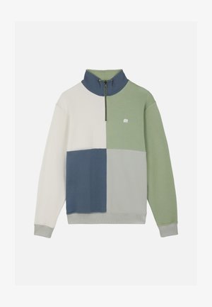 Sudadera con cremallera hasta un cuarto con bloques de color en crema, azul, verde y gris, con un pequeño logo de elefante blanco en el pecho.