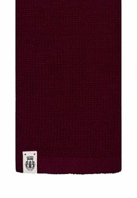 Burgundy ribbed knit scarf with a white logo label at the bottom. The texture appears soft and thick, suitable for warmth and durability.
