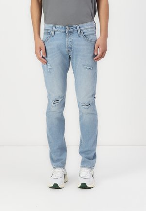 Lichtblauwe spijkerbroek met een slim fit, voorzien van versleten details en rafelige knieën, aangevuld met een traditionele vijf-pocketontwerp.