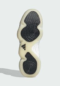 Sohlenprofil mit einem weißen und schwarzen Design, strukturiertem Gummi, spiralförmigen Mustern und einem erhabenen Logo mit einer markanten Form und Kurven.