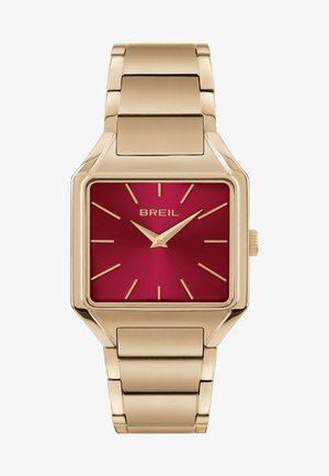 Gouden vierkante horloge met een rode wijzerplaat, voorzien van gouden uurmarkeringen en wijzers. Metalen schakelarmband met een gepolijste afwerking. Model: Breil.