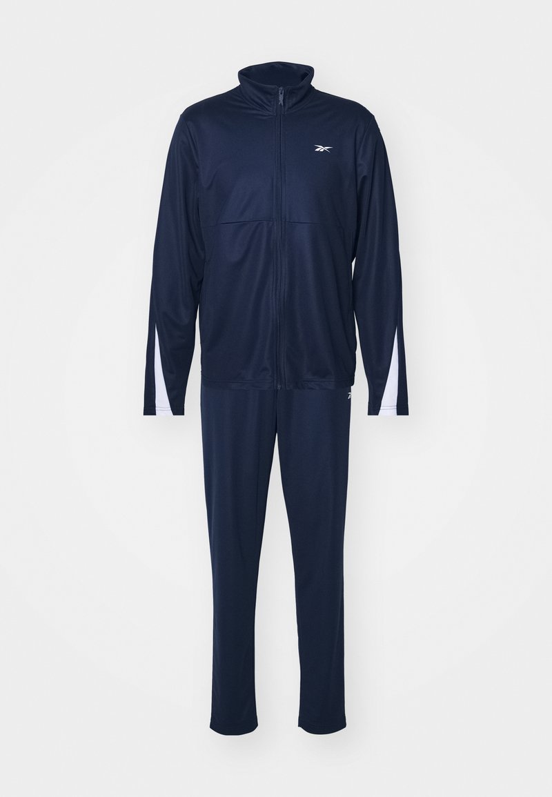 Chándal navy hecho de tejido suave y ligero. Presenta una chaqueta con cremallera y un cuello alto, así como detalles en blanco en las mangas y los pantalones.