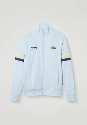 Hellblaues Trainingsjacke mit Reißverschluss, mit gelben und marineblauen Streifen an den Ärmeln, ellesse-Logo-Patch auf der linken Brust und gesticktem Logo auf der rechten Brust.
