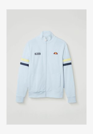 Hellblaues Trainingsjacke mit Reißverschluss, mit gelben und marineblauen Streifen an den Ärmeln, ellesse-Logo-Patch auf der linken Brust und gesticktem Logo auf der rechten Brust.