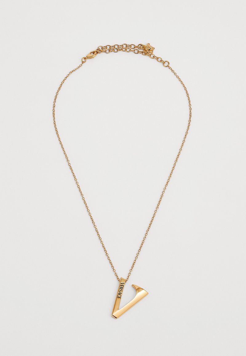 Gold chain necklace with a large, angled "V" pendant engraved with "VERSACE" on a white background.