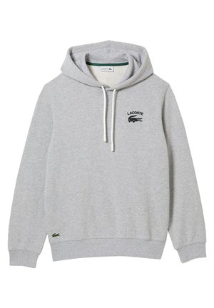 Hellgrauer Lacoste Hoodie mit Frontlogo, weißen Kordeln, gerippten Bündchen und kleinem gesticktem Krokodil nahe dem Bund.