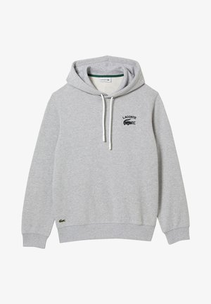Hellgrauer Lacoste Hoodie mit Frontlogo, weißen Kordeln, gerippten Bündchen und kleinem gesticktem Krokodil nahe dem Bund.