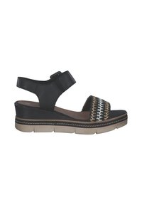 Black sandal featuring a woven upper with metallic accents, adjustable strap, and a chunky sole with textured detailing.