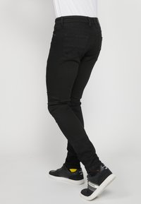 Koroshi Oprijete (skinny) kavbojke - denim black denim
