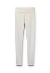 Ljust beige leggings med ett slätt, stretchigt tyg, hög midja och figurnära design som smalnar av vid vristen, utan mönster eller dekorationer.