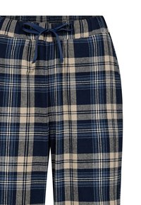 Navy og beige ternede loungbukser lavet af blødt stof med elastisk talje og snøre. Indeholder flere ternede mønstre.