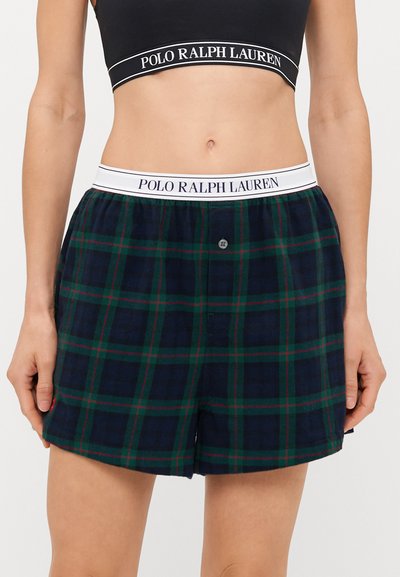 Mornarske karirane kratke hlače s zelenim i crvenim linijama, s bijelim elastičnim pojasom s brendom "POLO RALPH LAUREN" i jednim prednjim gumbom.