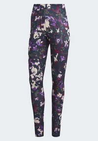 Leggings med hög midja, lila, vit och grön abstrakt blommönster, samt en liten Adidas-logotyp på lårets övre del.