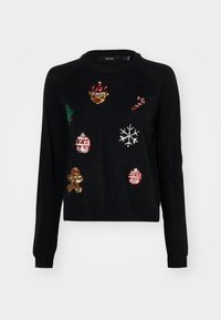 Pull noir à manches longues avec motifs de Noël en sequins : bonhomme en pain d'épices, canne en sucre d'orge, flocon de neige, décorations, houx et visage de renne.