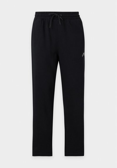 Μαύρο παντελόνι jogger με ελαστική μέση και κορδόνι, ίσια πόδια και μικρό λευκό λογότυπο στο επάνω αριστερό μηρό.