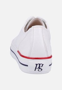 White leather shoe with a textured finish, red and blue accents on the sole, and a logo on the heel. Round toe and low-top design.