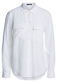 Chemise blanche à manches longues avec boutons, deux poches poitrine, col classique et ourlet arrondi, présentée sur un fond blanc uni.