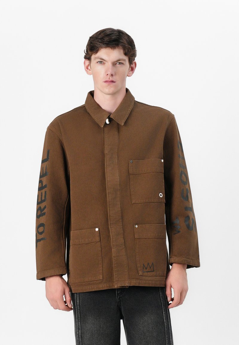 Études Spijkerjas bruin