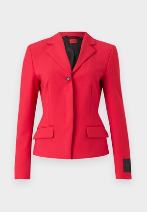 Red tailored jacket with a single button closure, lapel collar, and front pockets. Features a smooth fabric and sleek design.