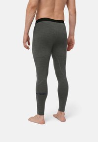 Grijze thermoleggings met een aansluitend ontwerp en een elastische tailleband. Heeft blauwe branding op het onderbeen. Gemaakt van een gestructureerd materiaal.