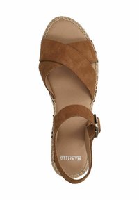 Brown suede sandal with crisscross straps, open toe, and ankle buckle. Features stitched edge detailing on a lightweight sole.