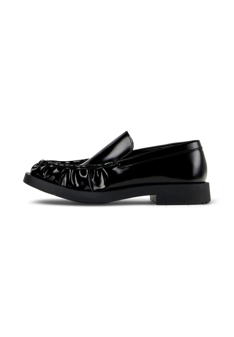 Black shiny leather loafer with gathered detailing on upper, low heel, and smooth sole, shown from side on white background.