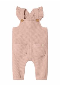 Salopette rosa con texture, spalline arricciate, bottoni in legno e due tasche frontali. Realizzata in un materiale morbido e traspirante.