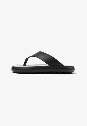 Svart flip-flop med en slät syntetläderrem, gummisulor och ett vadderat fotbed med ett vitt inredningsmönster.