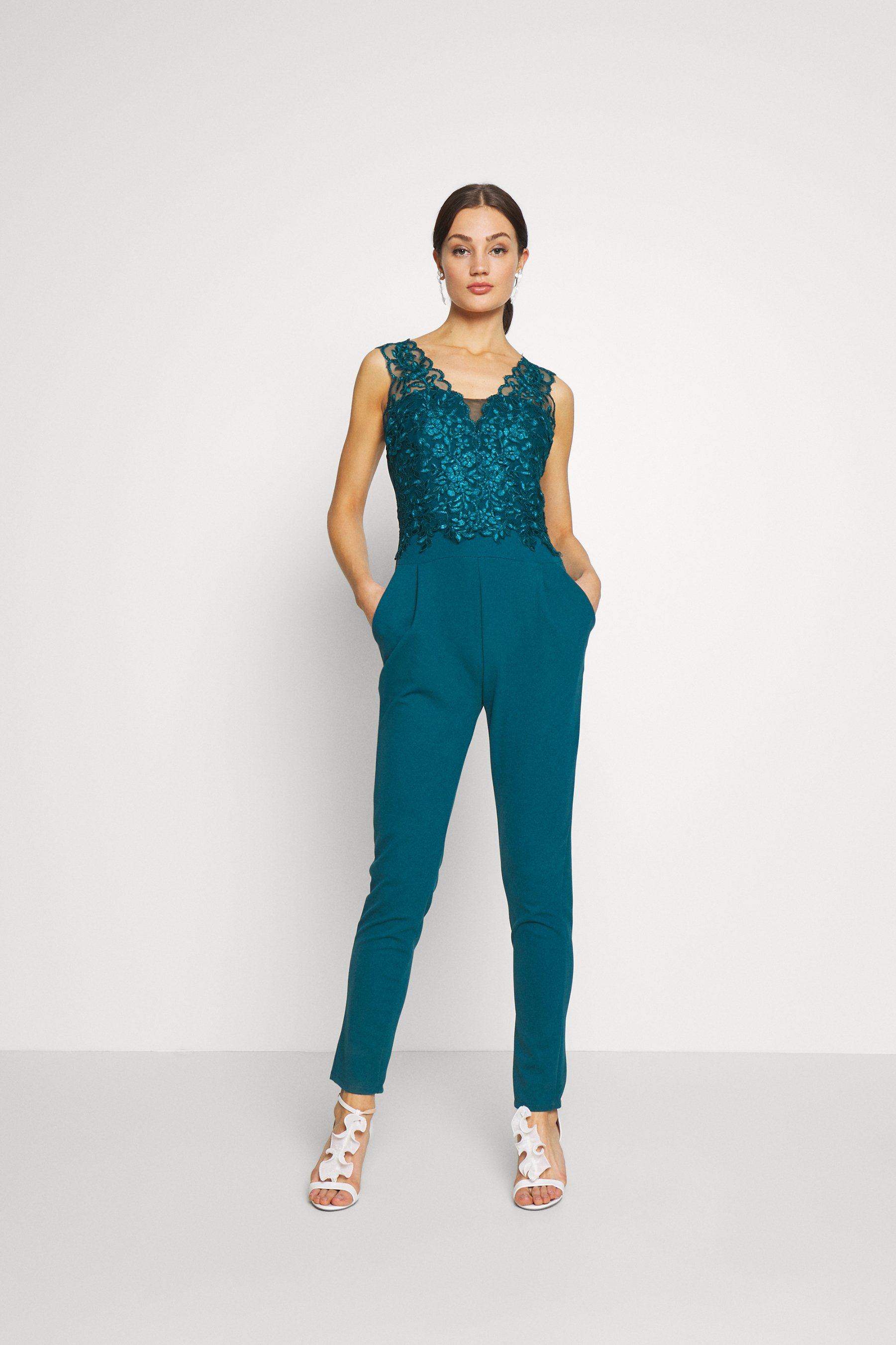 teal colored jumpsuits