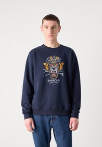 Navy sweatshirt made of cotton blend, featuring a graphic of a tiger with goggles, and "Barbour International" text at the bottom.