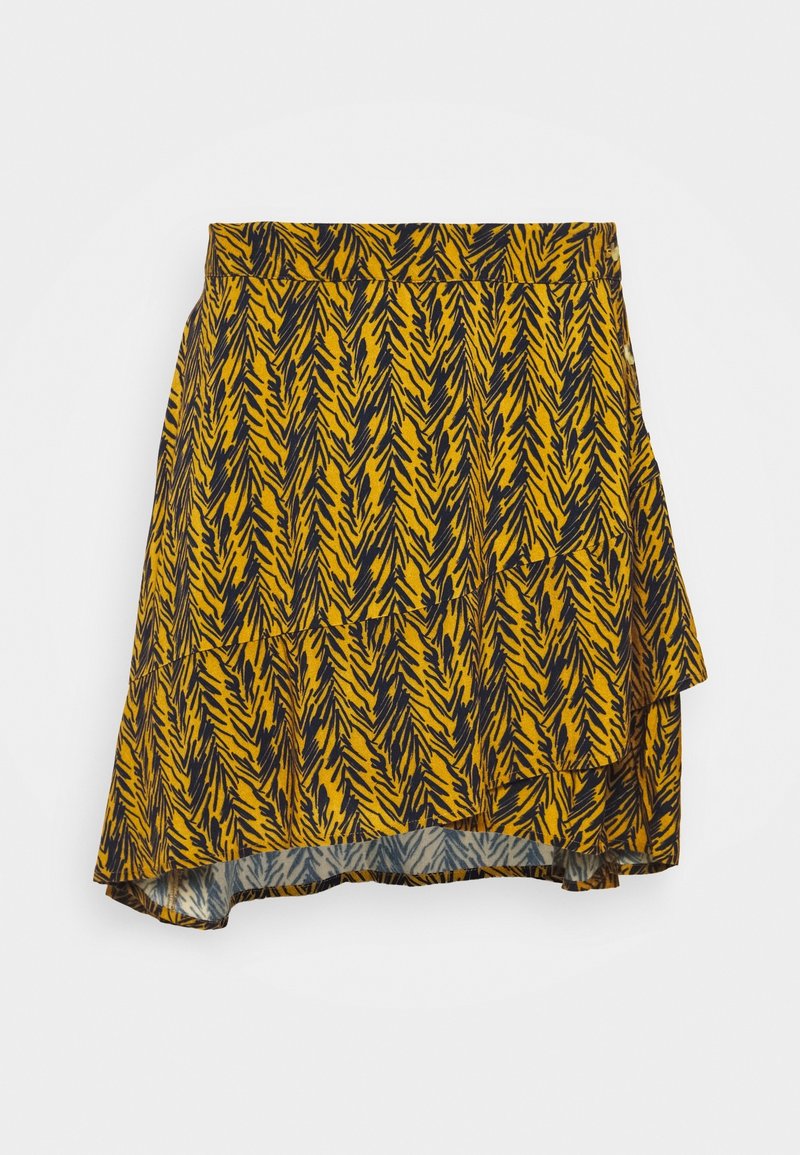Jupe jaune avec un motif de feuilles noires, tissu léger, ourlet asymétrique et taille élastique. Le devant se chevauche pour plus de détail.
