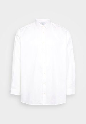 Vit långärmad skjorta med knappar i bomull. Har en spetsig krage och sex knappar fram. Slät textur, normal passform.