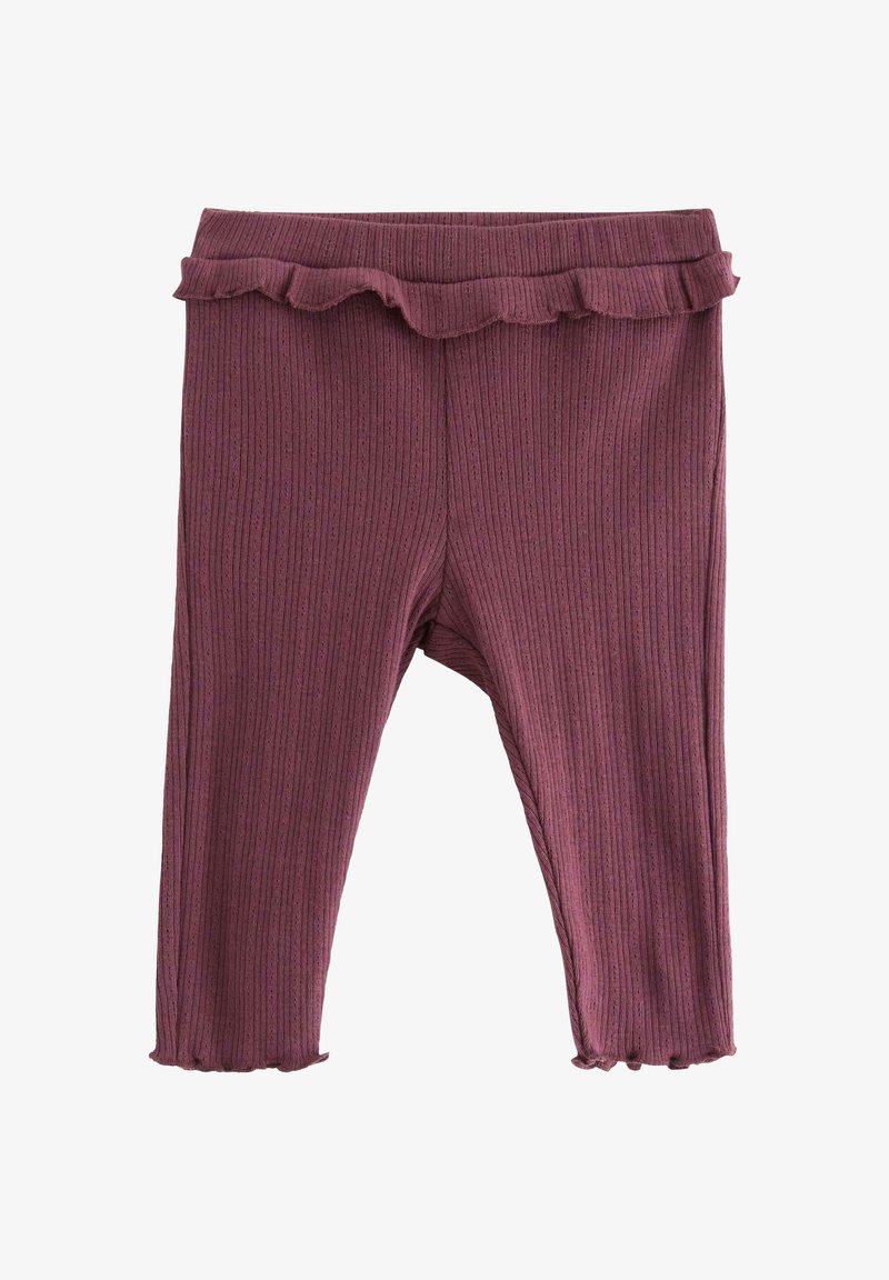 Ribbede lilla leggings med volangliv og elastiske mansjetter. Mykt, stretchy materiale med en tettsittende fasong.