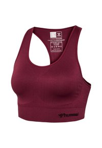 Brassière de sport marron foncé avec design dos nageur, texture côtelée sans couture et logo "hummel" sur la bande inférieure. Taille XS avec instructions d'entretien imprimées à l'intérieur.